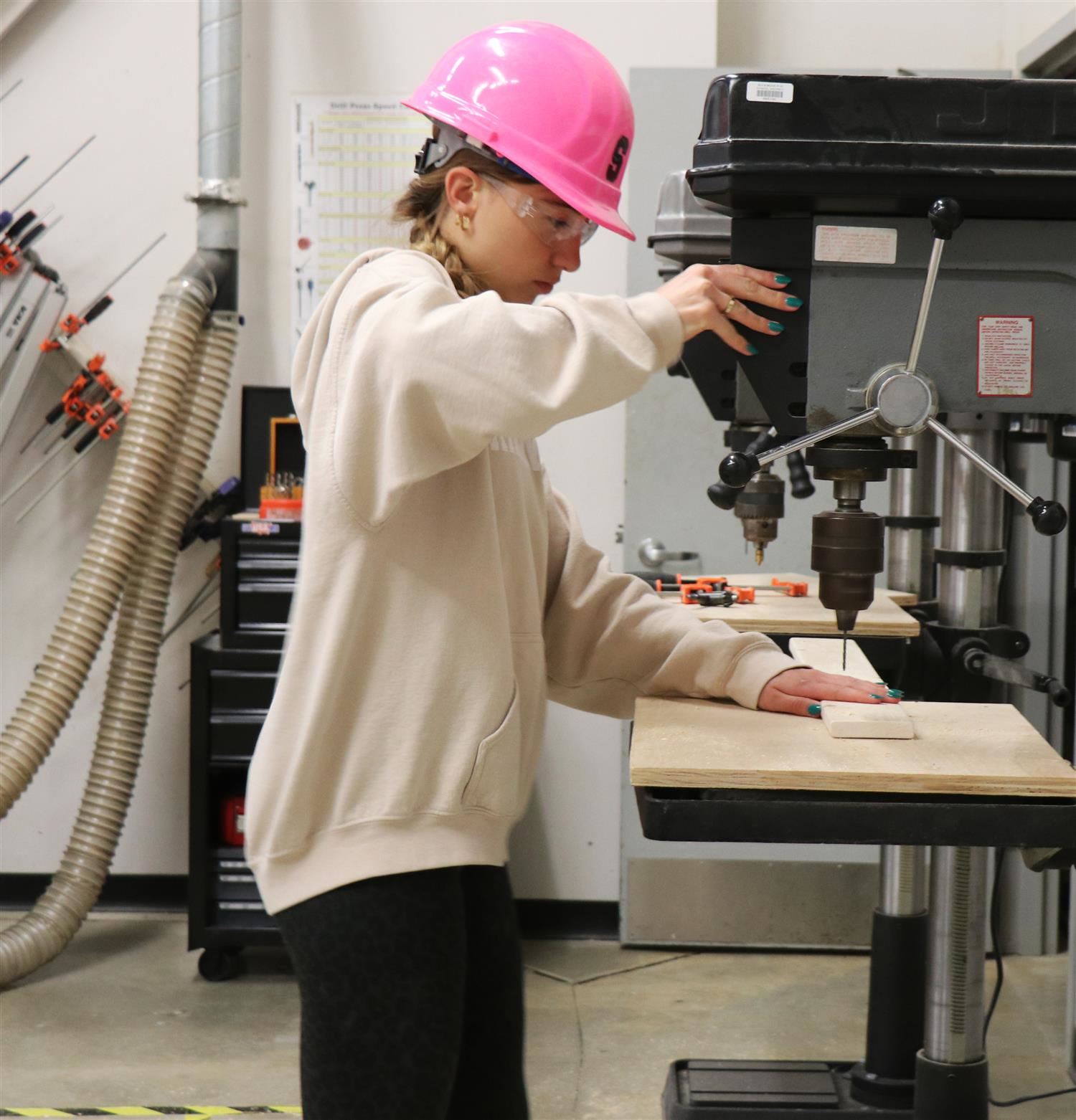A student works on a bunk bed project in her Geometry in Construction class
