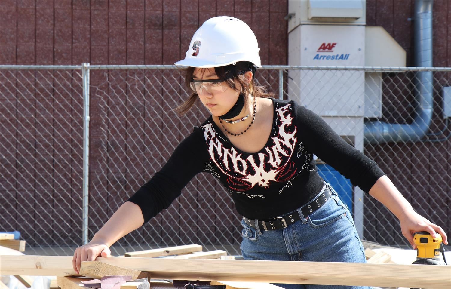 A student works on a bunk bed project in her Geometry in Construction class